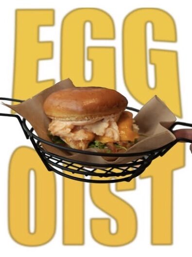 EGGoist sandwich over giant yellow type