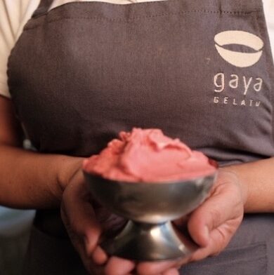 Gaya Gelato chef holding a bowl of raspberry sorbet